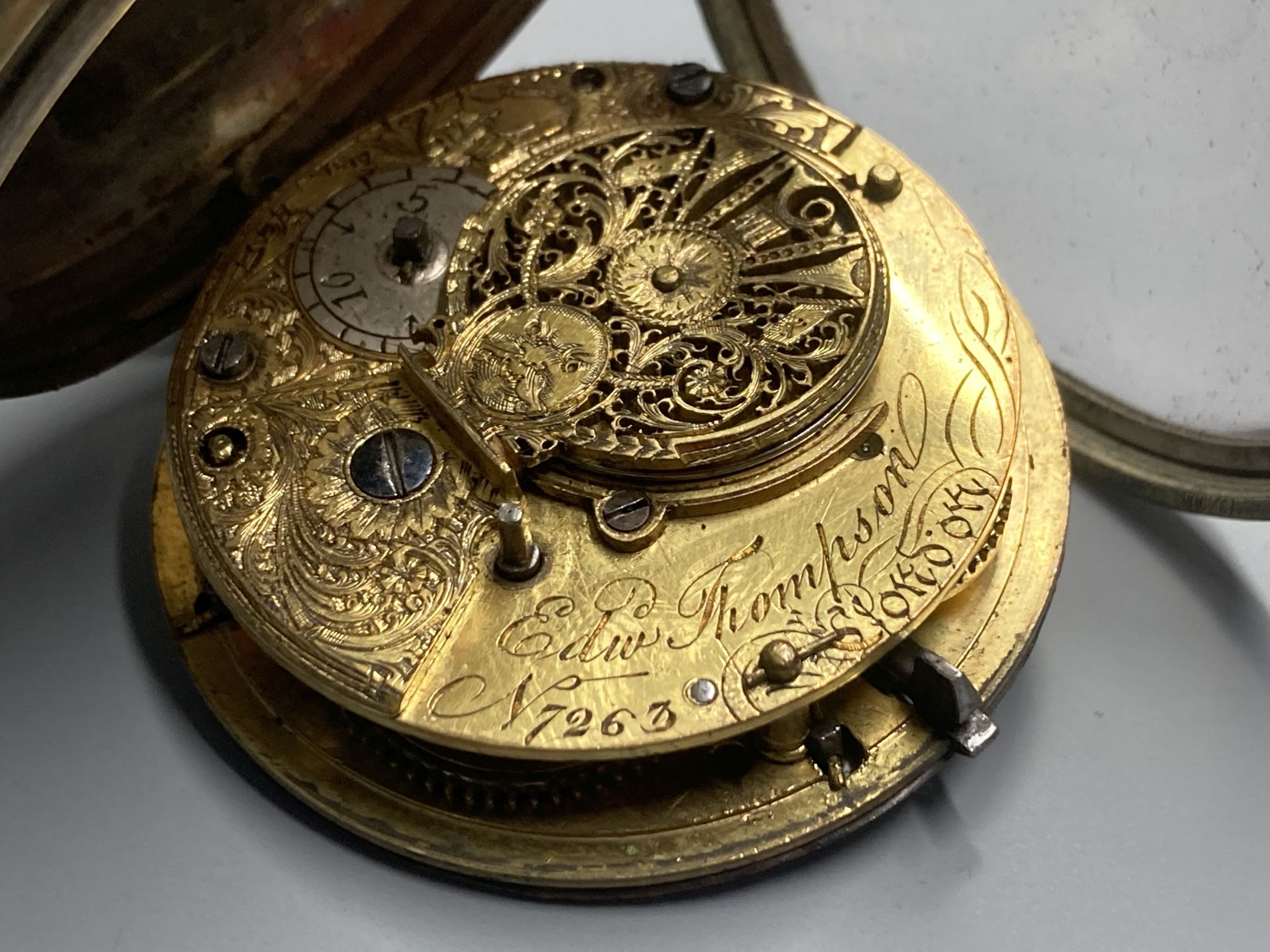 A 19th century brass cased keywind verge pocket watch, by Edward Thompson, London, numbered 7623,